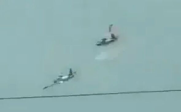 Horror as two planes crash in huge mid-air smash with debris scattered