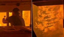 Horrific video shows men trapped inside train as intense wildfire closes in