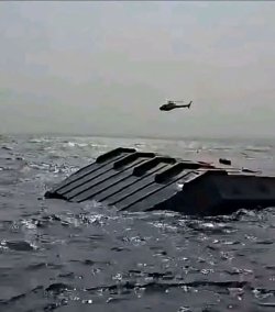 At least 15 dead and more missing after ferry capsizes on huge lake filled with crocodiles