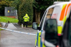 Man, 61, held after woman, 47, dies in 'distressing' Bridgend incident